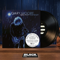 Escena editorial BVRS cálida de Gary Moore Bad For You Baby con portada y dos vinilos negros protagonistas