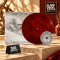 Sepultura con disco rojo y disco pequeño plateado en una escena cálida de Black Vinyl Records Spain