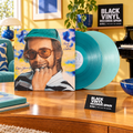 Elton John - Rock of the Westies, escena editorial BVRS con vinilos turquesa y ambiente setentero